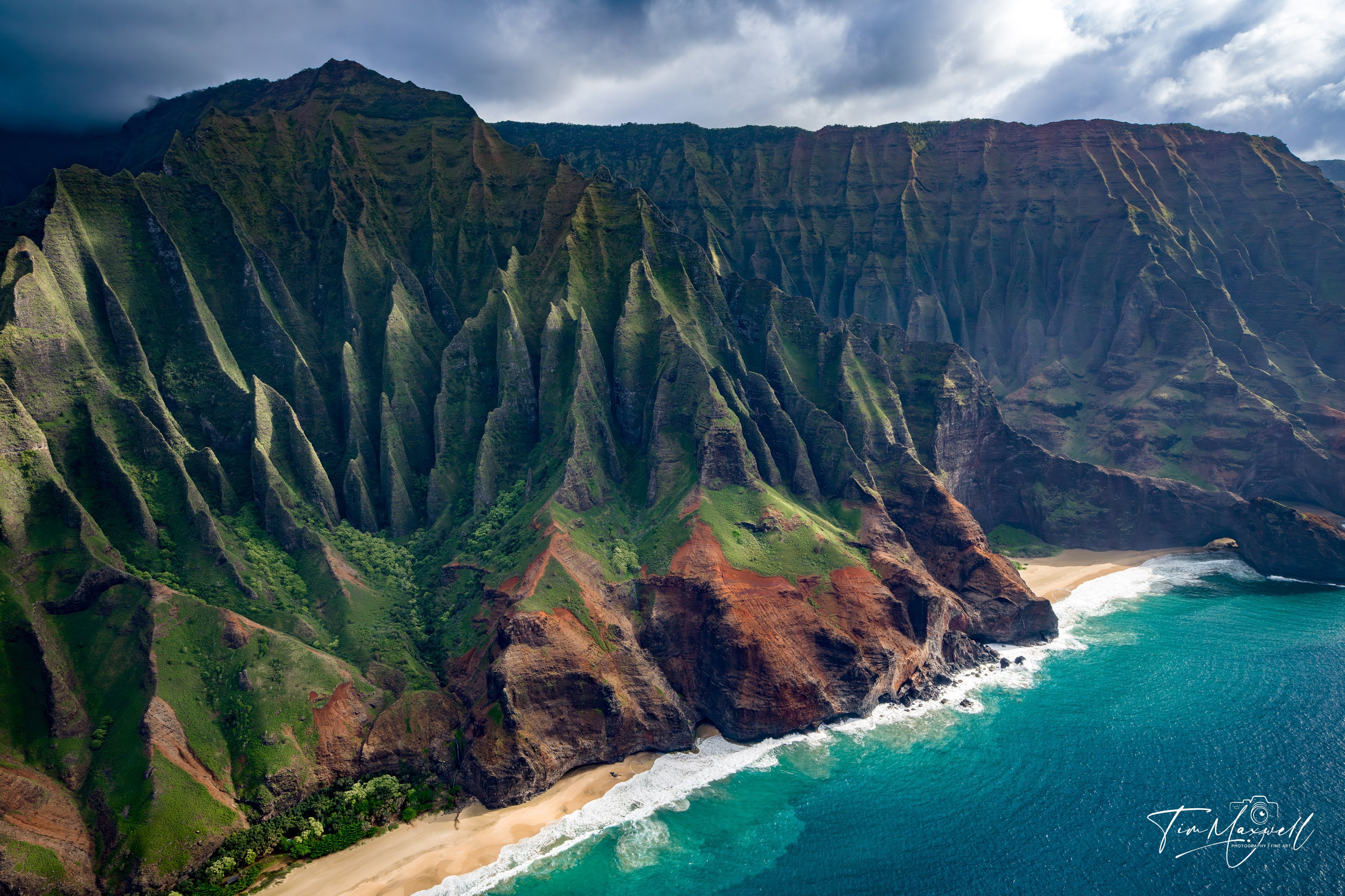 Aerial view of Kauai’s Na Pali Coast cliffs and beaches, fine art print by Tim Maxwell.