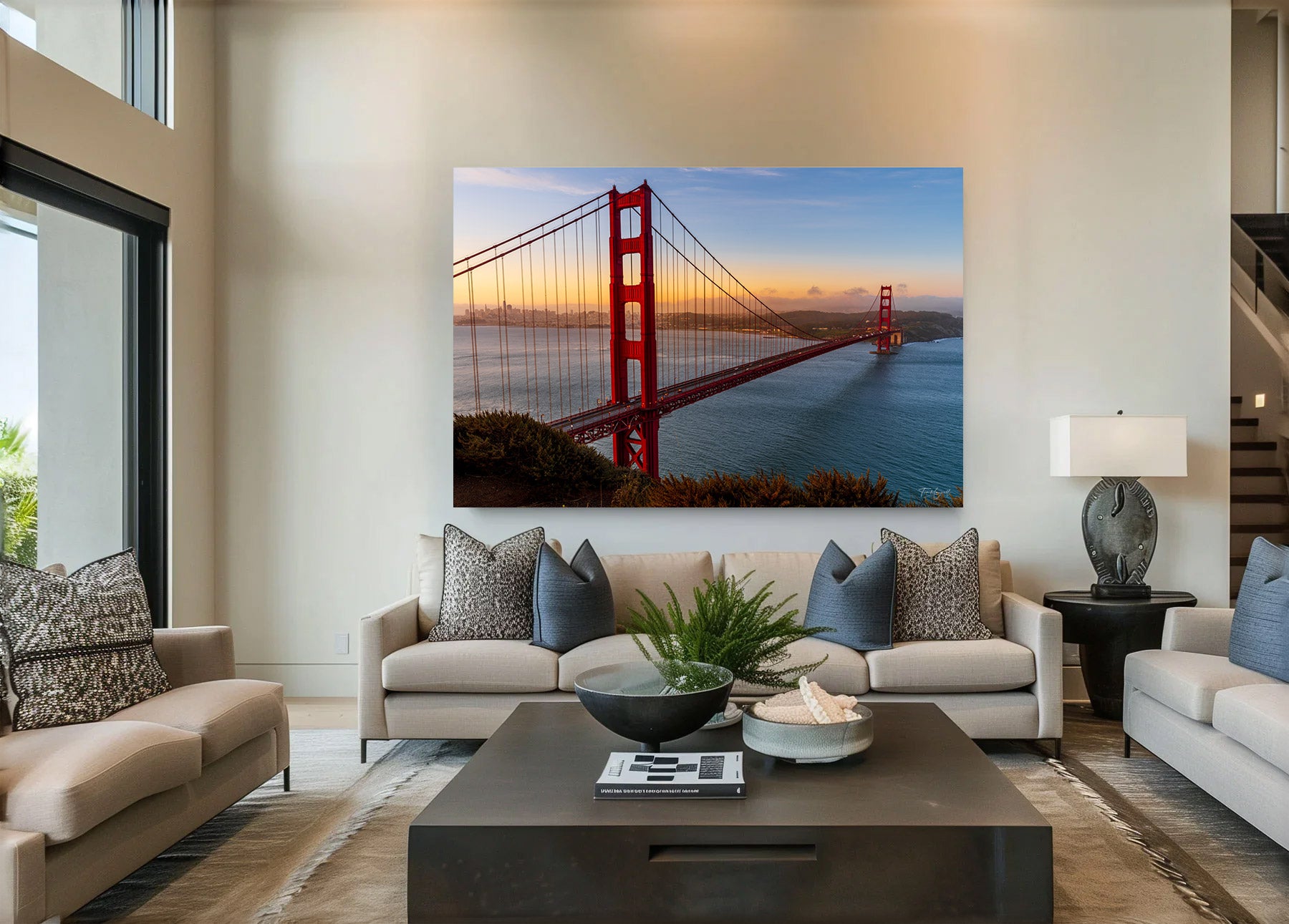 Large acrylic print of the Golden Gate Bridge at sunrise displayed on a modern living room wall